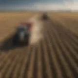 A field of crops with agricultural machinery