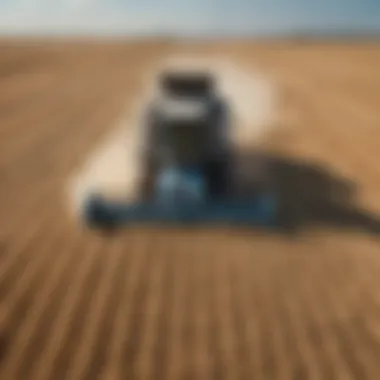 A modern combine harvester operating in a wheat field under clear blue skies.