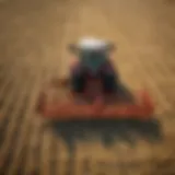A used rotary rake in action, efficiently gathering hay in a field.