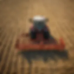 A used rotary rake in action, efficiently gathering hay in a field.
