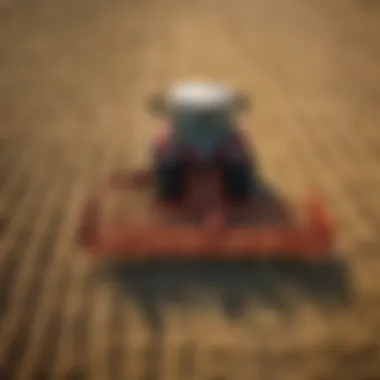 Efficiency of Used Rotary Rakes in Hay Collection A used rotary rake in action, efficiently gathering hay in a field.