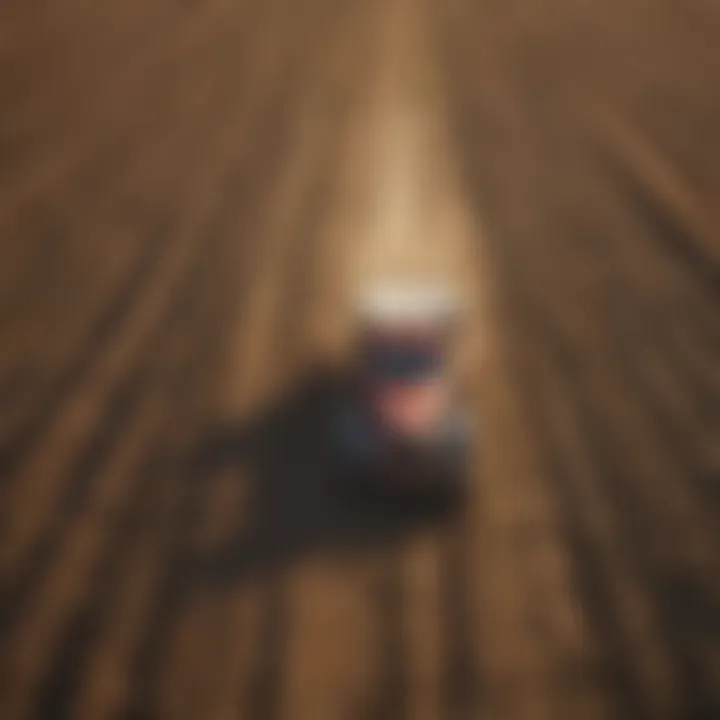 Used frontier pickup navigating through agricultural field