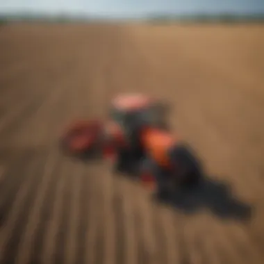 Kubota Tractor in a Vast Agricultural Field Kubota tractor navigating through a vast field