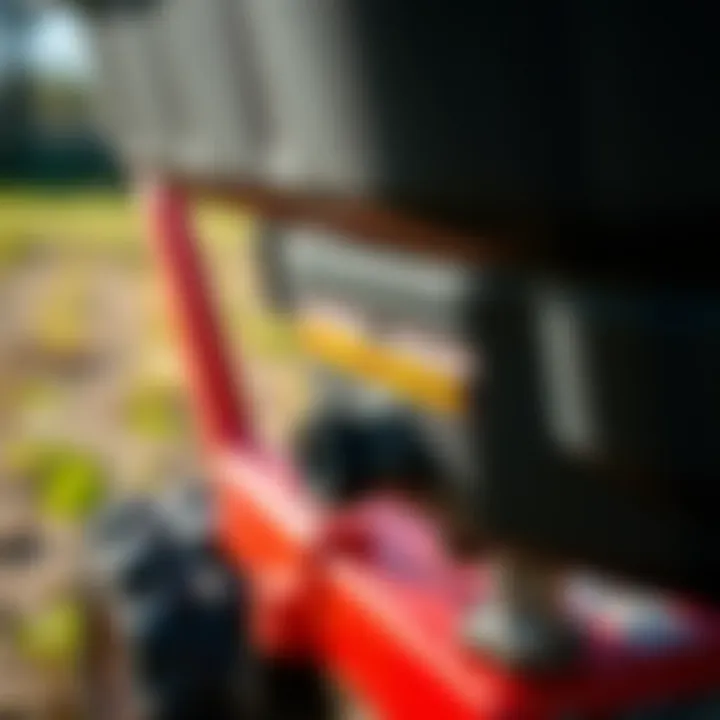 Adjustable Settings of a Mini Lawn Spreader A close-up of the adjustable settings on a mini lawn spreader highlighting its versatility