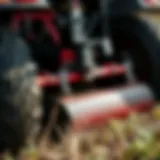 Close-up of a tilling attachment on a riding mower