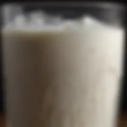 A close-up of whole milk kefir in a glass with a creamy texture.